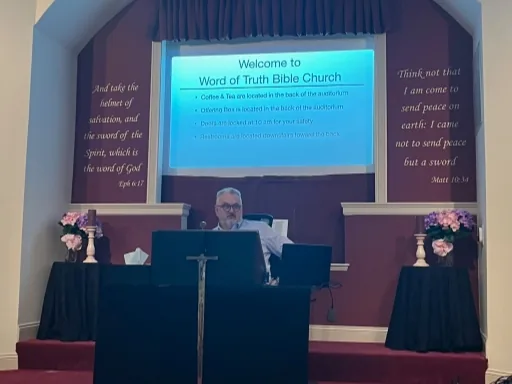 The pastor teaching in the auditorium